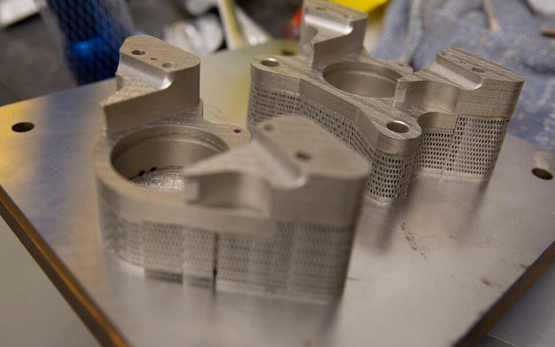 close up images of metallic 3D-printed objects created in a manufacturing engineering process